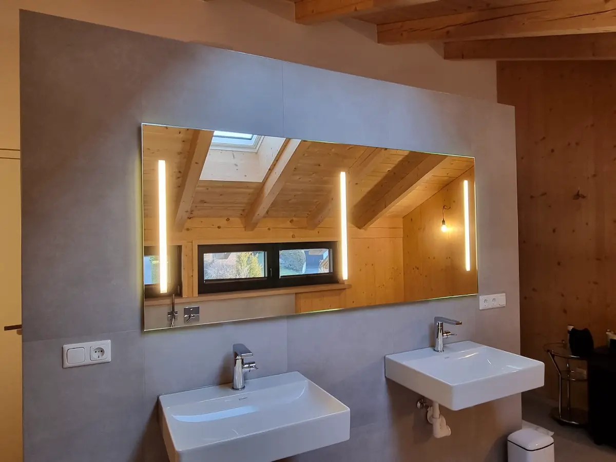 Glass in interior design - Illuminated mirror in the bathroom